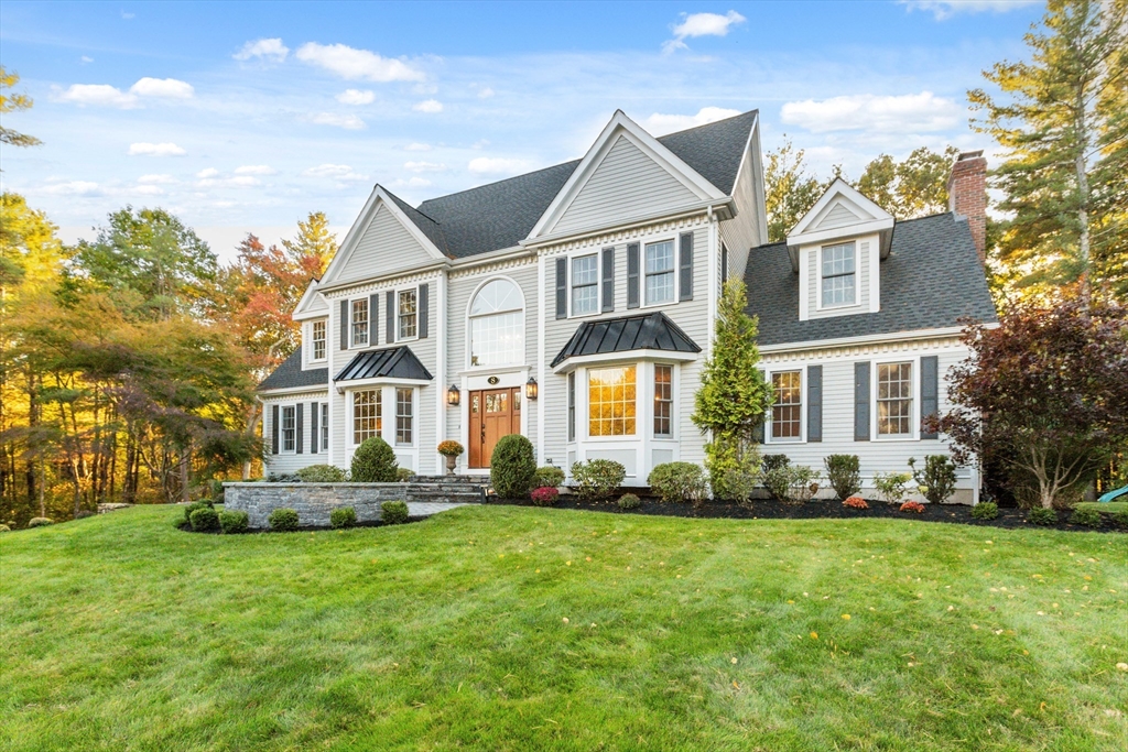 8 MacIntyre Drive North Reading, MA 01864 - Photo 4 of 42 a front view of a house with a yard