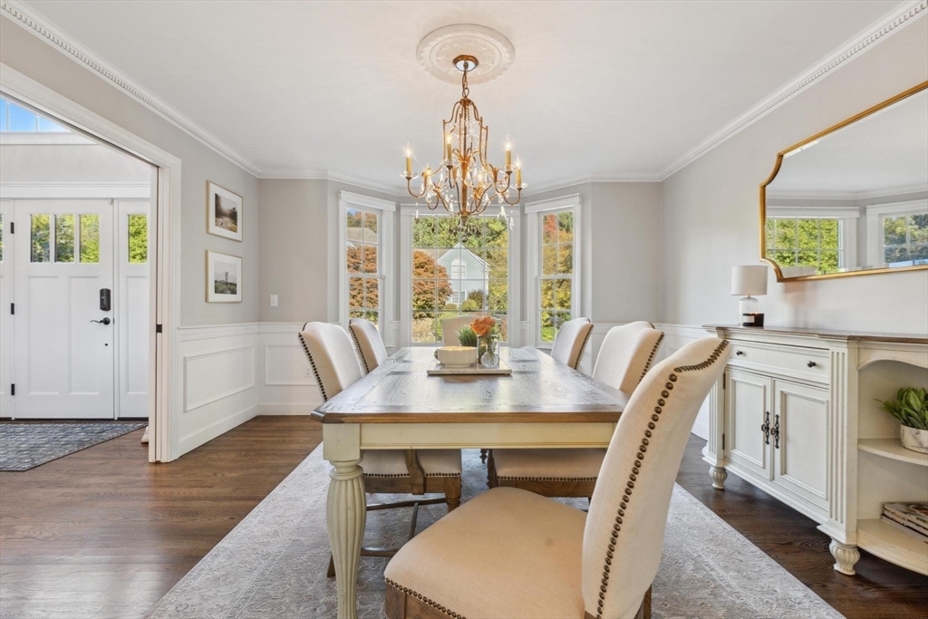 8 MacIntyre Drive North Reading, MA 01864 - Photo 8 of 42 a view of a dining room with furniture window and wooden floor