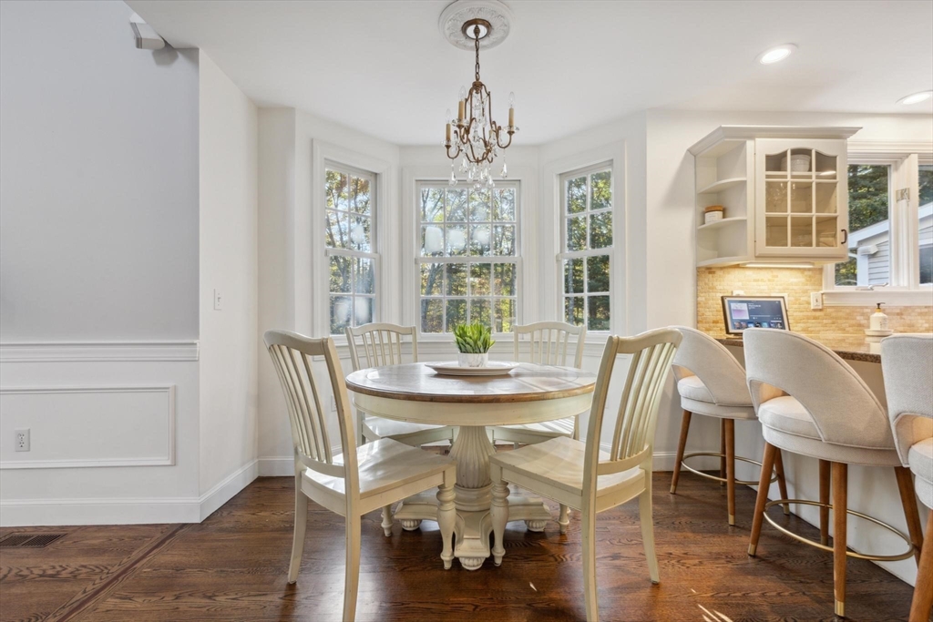 8 MacIntyre Drive North Reading, MA 01864 - Photo 10 of 42 a view of a dining room with furniture window and wooden floor