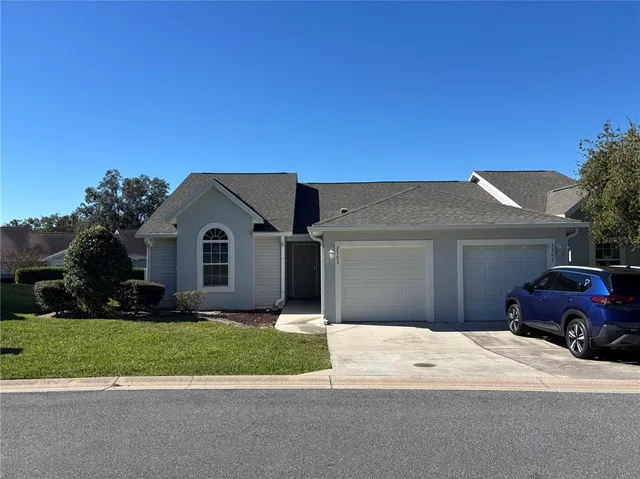 a view of a swimming pool and trees in the background