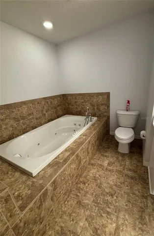 a bathroom with a sink a toilet and a bathtub