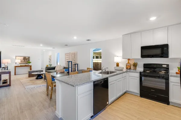 a bedroom with a bed and a lamp