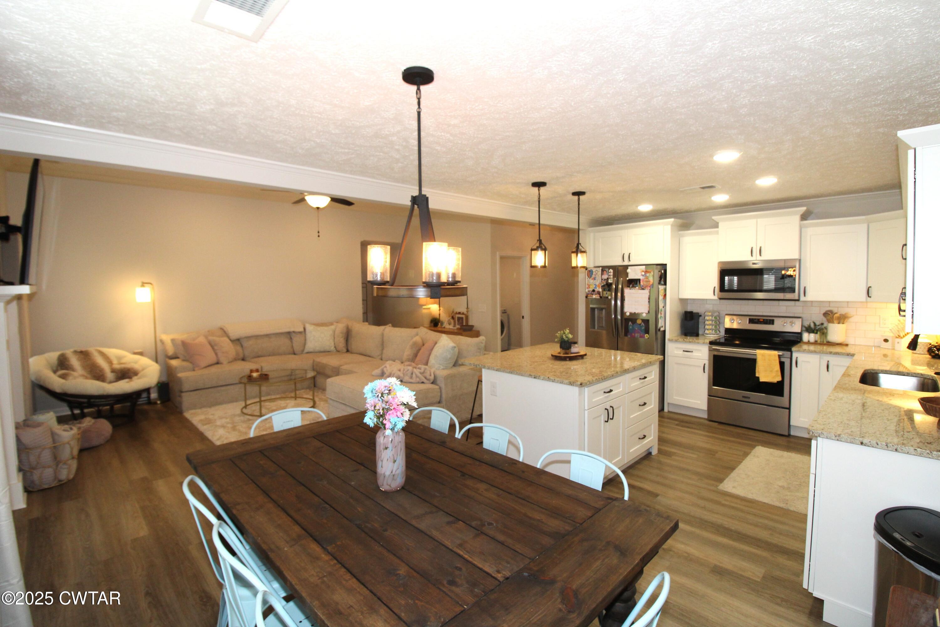 6151 Windsor Drive Milan, TN 38358 - Photo 12 of 25 a living room with furniture and kitchen view