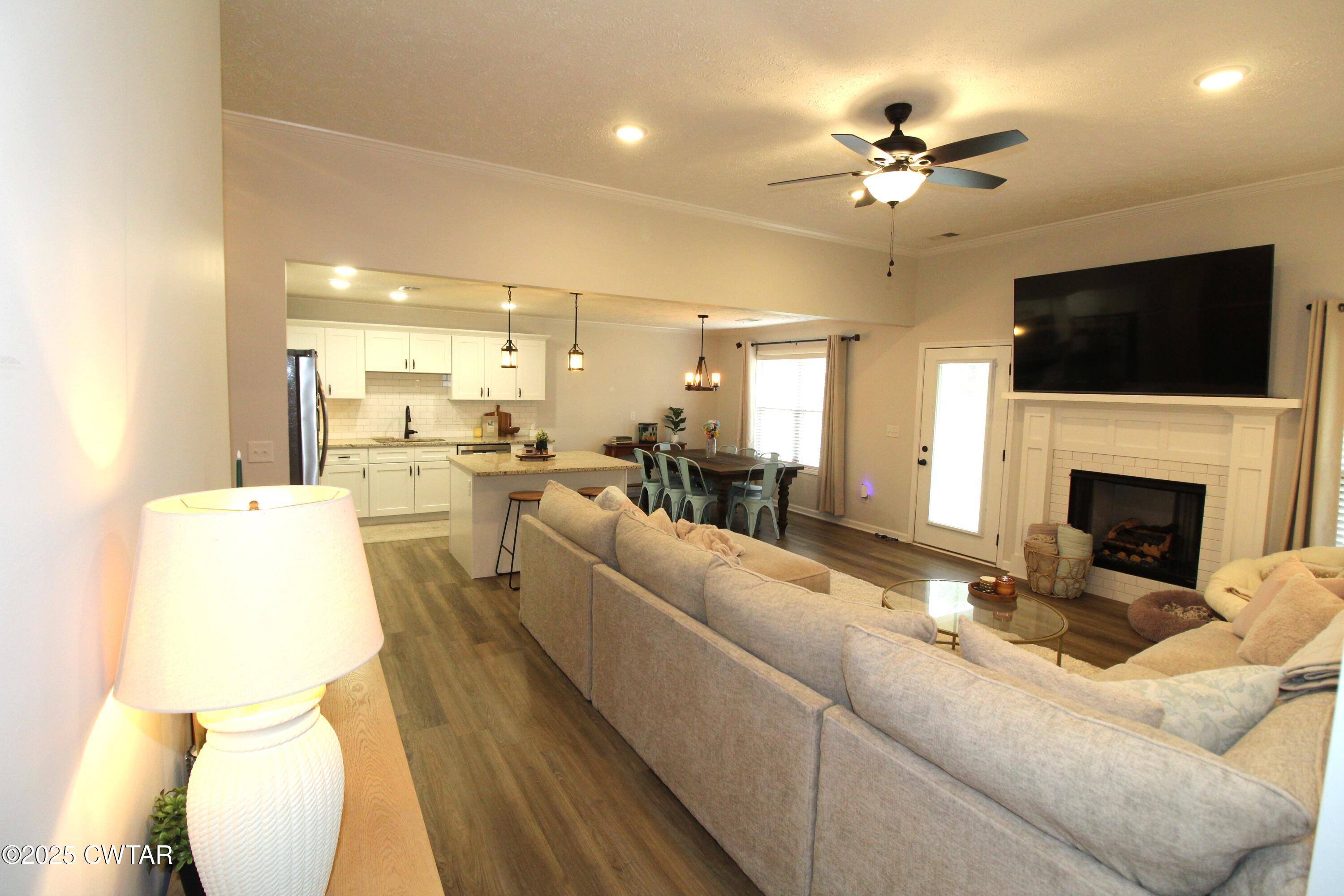 6151 Windsor Drive Milan, TN 38358 - Photo 4 of 25 a living room with furniture and a fireplace