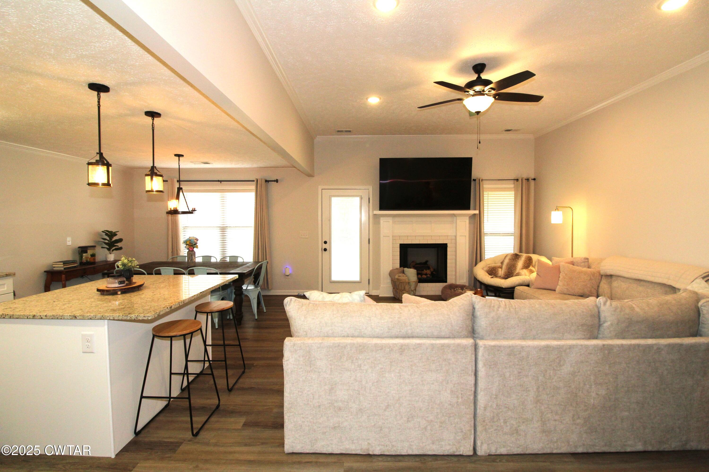 6151 Windsor Drive Milan, TN 38358 - Photo 6 of 25 a living room with furniture and a fireplace