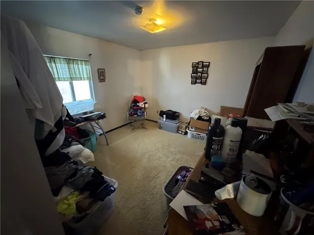 a room with furniture and a flat screen tv