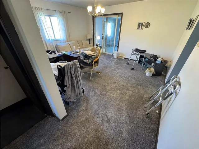 a view of a livingroom with furniture and windows