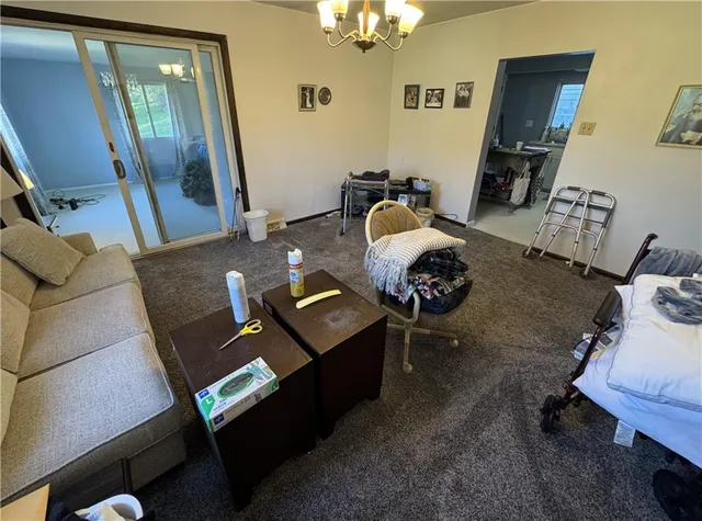 a living room with furniture and a table