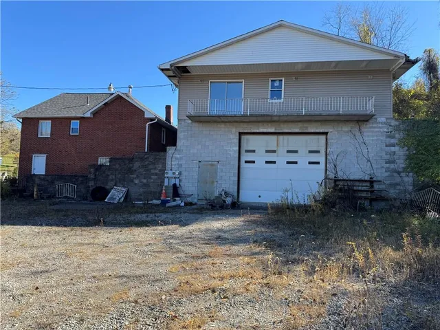 a view of a field of grass and trees