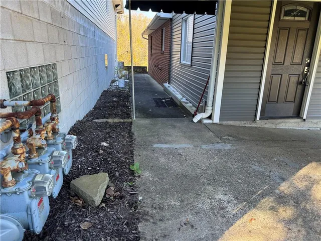 a view of a backyard with sitting area