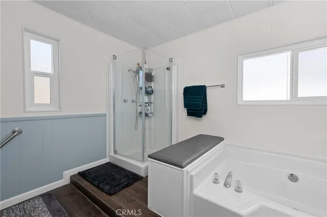 a bathroom with a bathtub and a shower