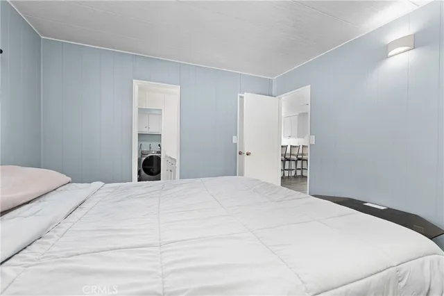 a bedroom with a bed and a closet