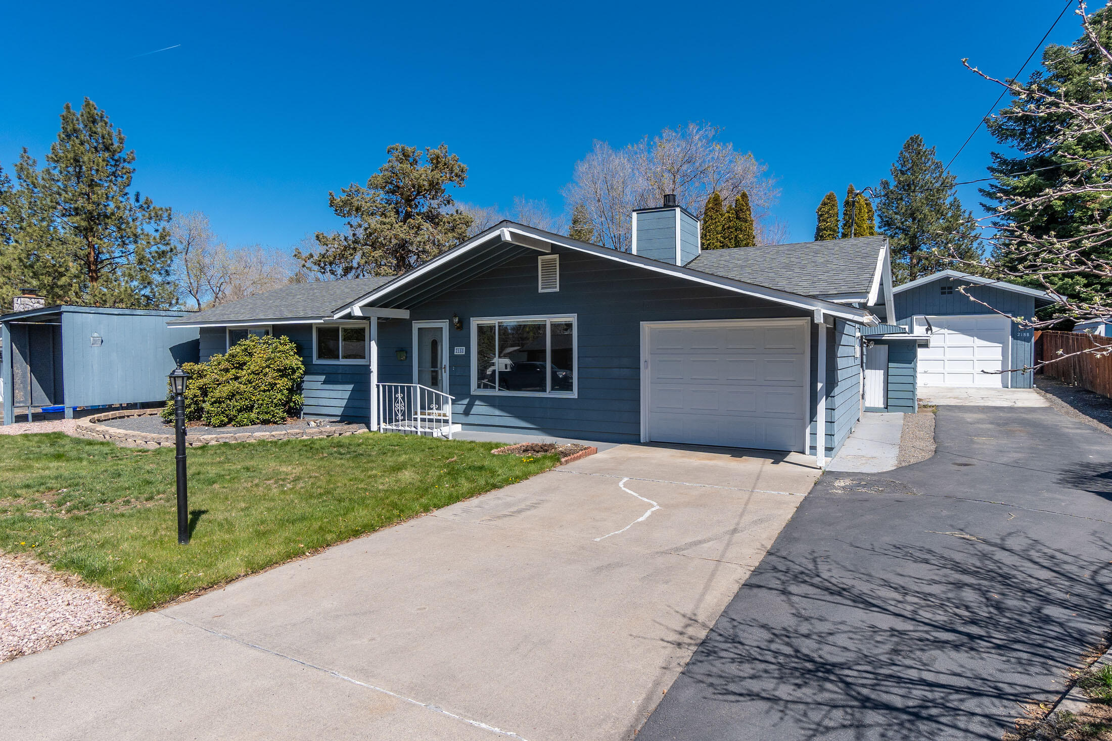 2188 Northeast Shepard Road Bend, OR 97701 - Photo 9 of 52 Concrete driveway and also paved driveway on the right into detached garage/shop!