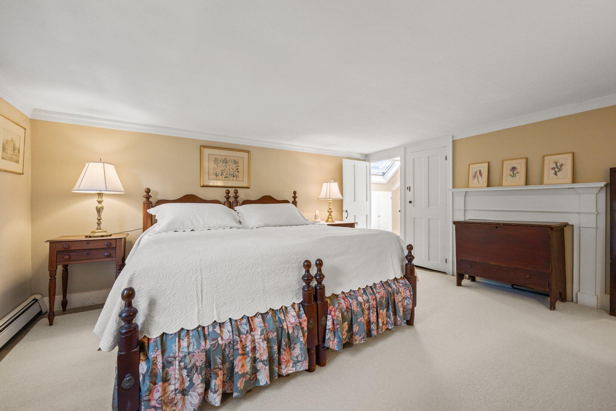1955 Bridge Road Eastham, MA 02642 - Photo 31 of 77 a bedroom with a bed and a fireplace