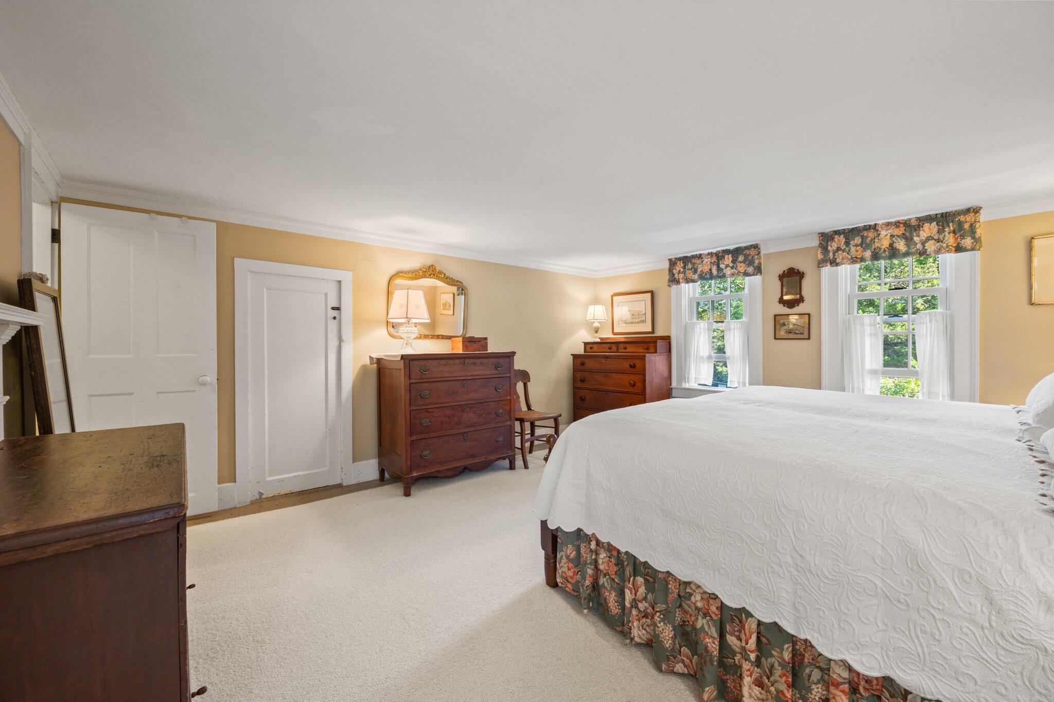 1955 Bridge Road Eastham, MA 02642 - Photo 33 of 77 a spacious bedroom with a bed dresser and a large window