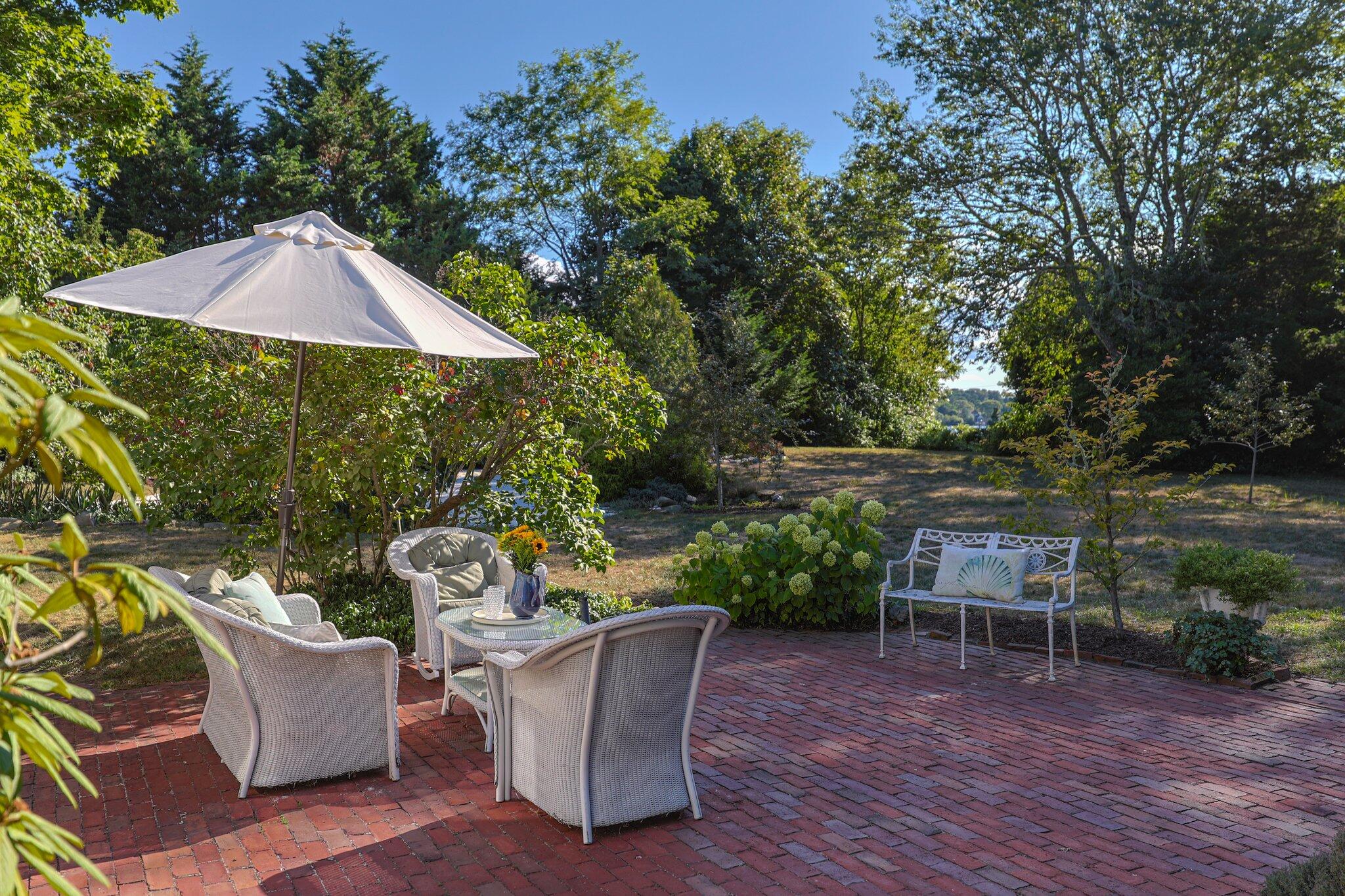 1955 Bridge Road Eastham, MA 02642 - Photo 39 of 77 an outdoor sitting area with furniture and wooden floor