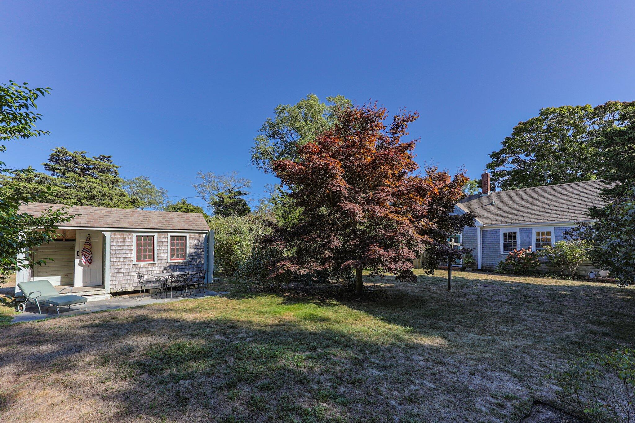 1955 Bridge Road Eastham, MA 02642 - Photo 41 of 77 a front view of a house with a yard
