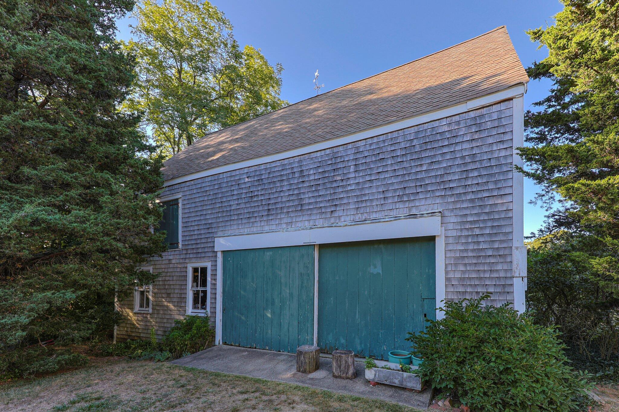 1955 Bridge Road Eastham, MA 02642 - Photo 52 of 77 a front view of a house with garden