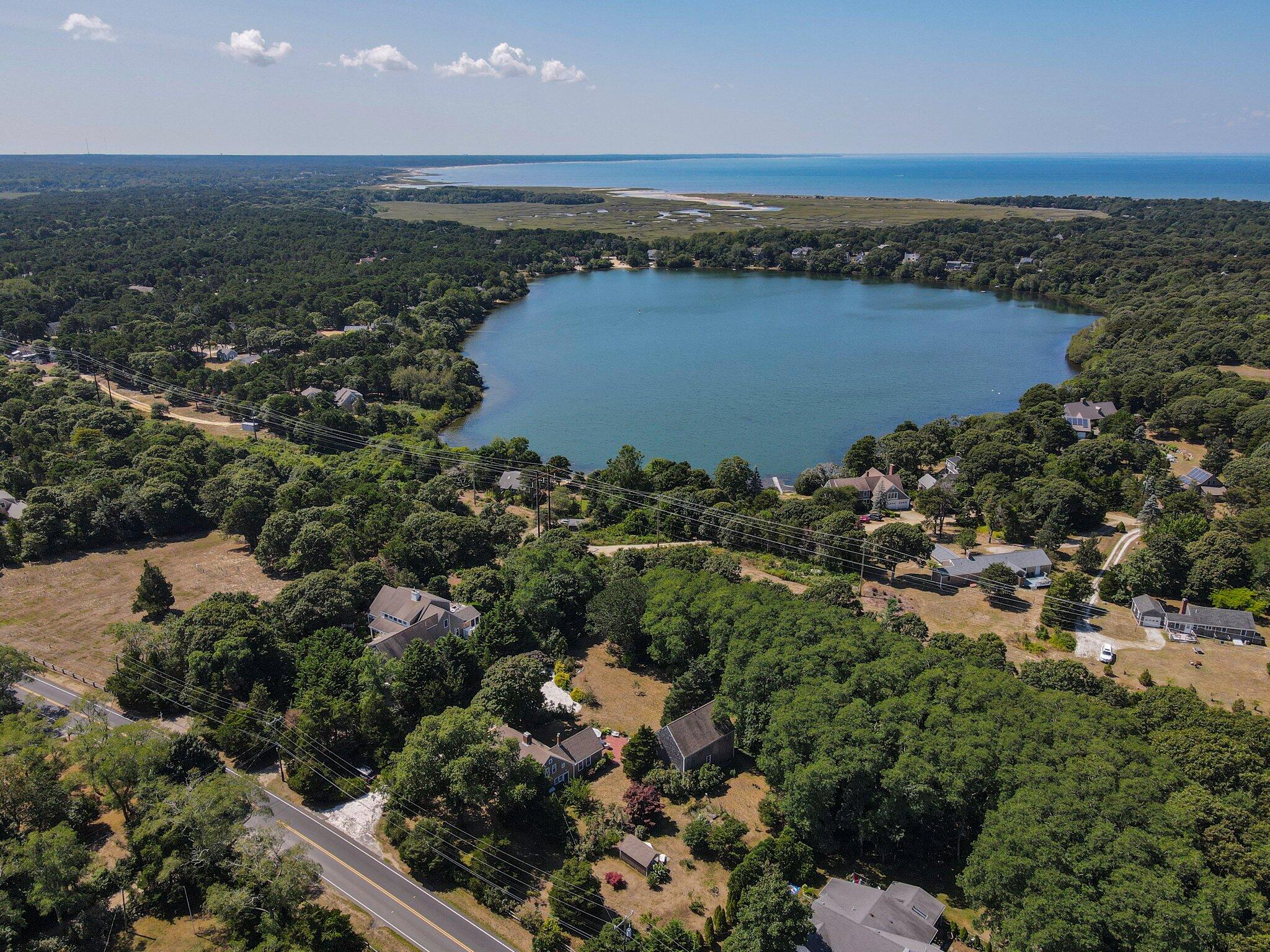 1955 Bridge Road Eastham, MA 02642 - Photo 63 of 77 an aerial view of residential houses with outdoor space and trees