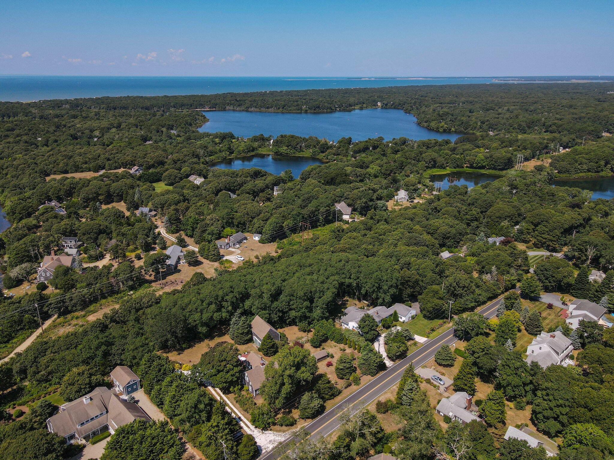 1955 Bridge Road Eastham, MA 02642 - Photo 65 of 77 an aerial view of residential houses with outdoor space and trees