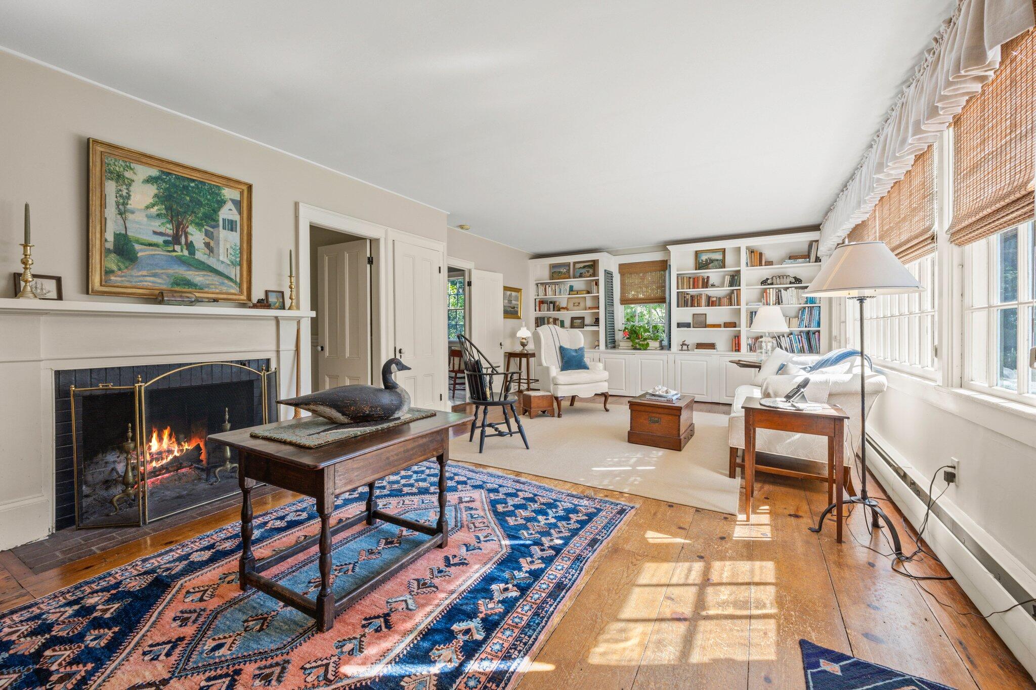 1955 Bridge Road Eastham, MA 02642 - Photo 10 of 77 a living room with furniture and a fireplace