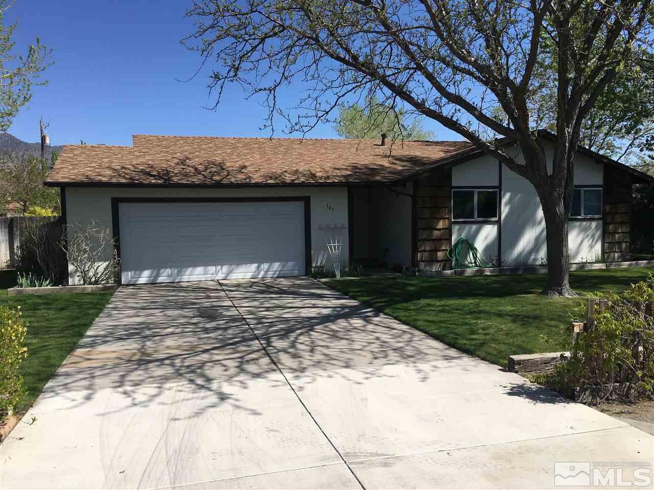 143 Ring Road Dayton, NV 89403 - Photo 2 of 7 a front view of a house with garden