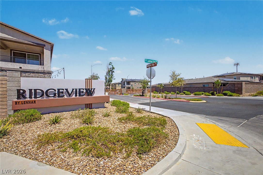 226 Augusta Ridge Henderson, NV 89015 - Photo 36 of 47 An inviting entrance welcomes residents to this modern community, featuring well-maintained landscaping and clear signage.