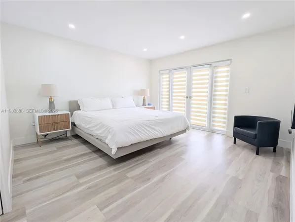 a bedroom with a bed and a table