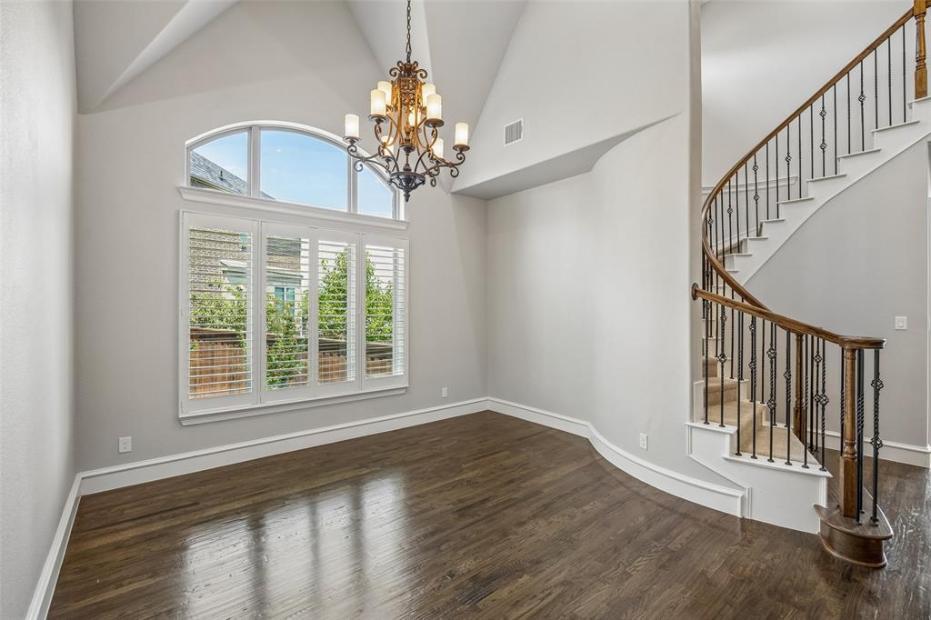 134 Santa Rosa Way Irving, TX 75062 - Photo 10 of 26 Inviting living area with dramatic ceilings and flexible space for relaxing, entertaining, or a study setup.