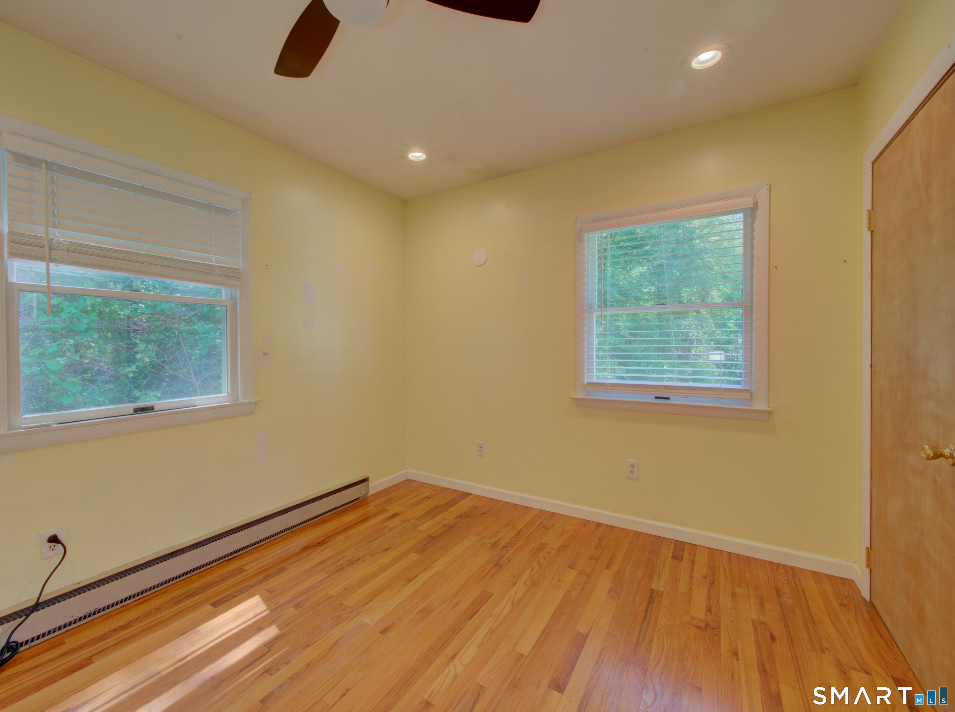 311 Sandy Hollow Road Groton, CT 06355 - Photo 8 of 26 a view of a room with wooden floor and natural light