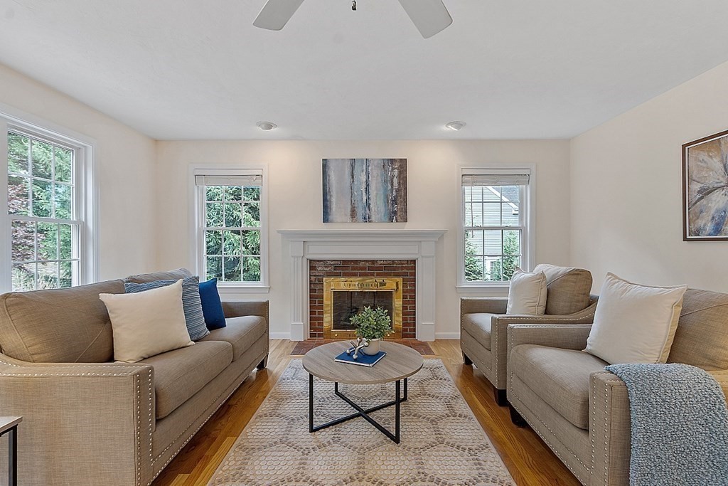 12 Whitetail Way Littleton, MA 01460 - Photo 14 of 39 a living room with furniture and a fireplace