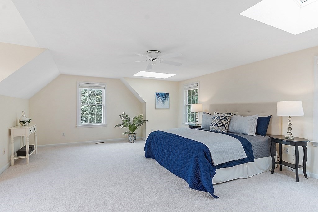 12 Whitetail Way Littleton, MA 01460 - Photo 18 of 39 a spacious bedroom with a bed and a window