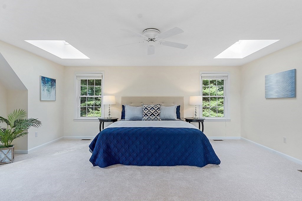 12 Whitetail Way Littleton, MA 01460 - Photo 20 of 39 a spacious bedroom with a bed window and potted plant