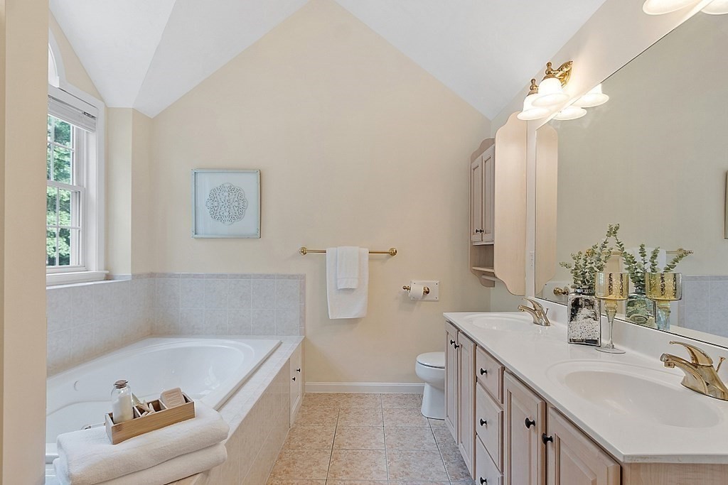 12 Whitetail Way Littleton, MA 01460 - Photo 22 of 39 a bathroom with a tub sink and mirror