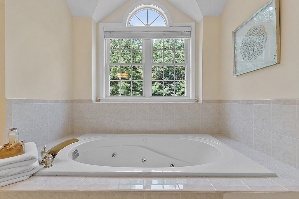 12 Whitetail Way Littleton, MA 01460 - Photo 23 of 39 a bathroom with a bathtub and a window