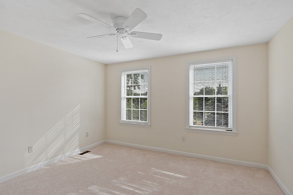 12 Whitetail Way Littleton, MA 01460 - Photo 26 of 39 an empty room with windows and fan