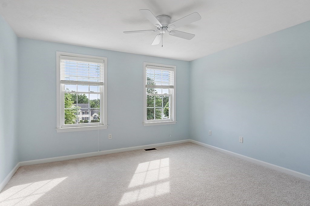 12 Whitetail Way Littleton, MA 01460 - Photo 28 of 39 an empty room with a window and a fan