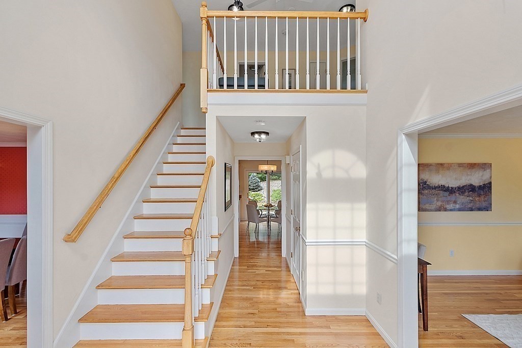 12 Whitetail Way Littleton, MA 01460 - Photo 3 of 39 a view of a hallway with wooden floor and windows