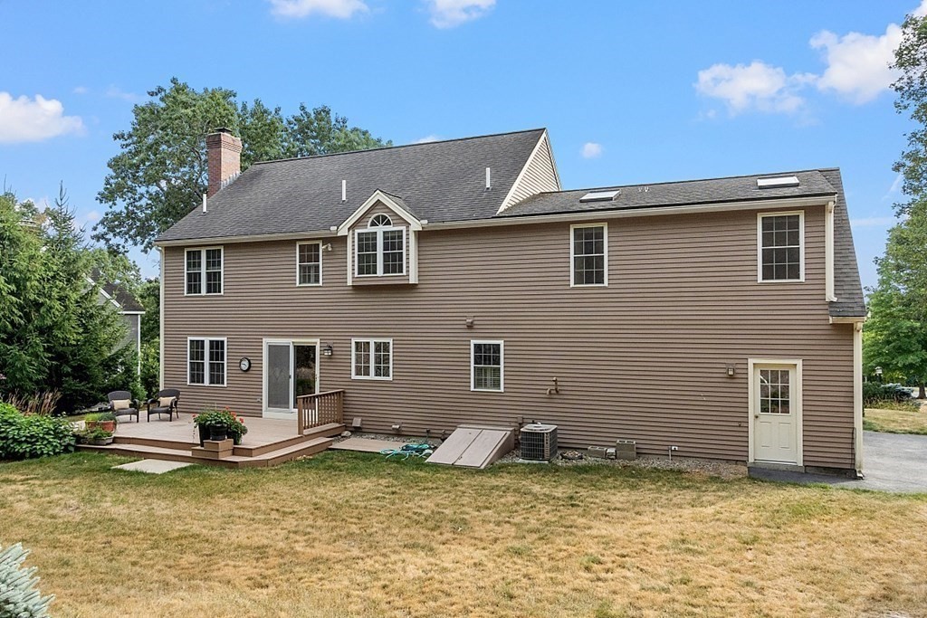 12 Whitetail Way Littleton, MA 01460 - Photo 36 of 39 a front view of a house with a yard