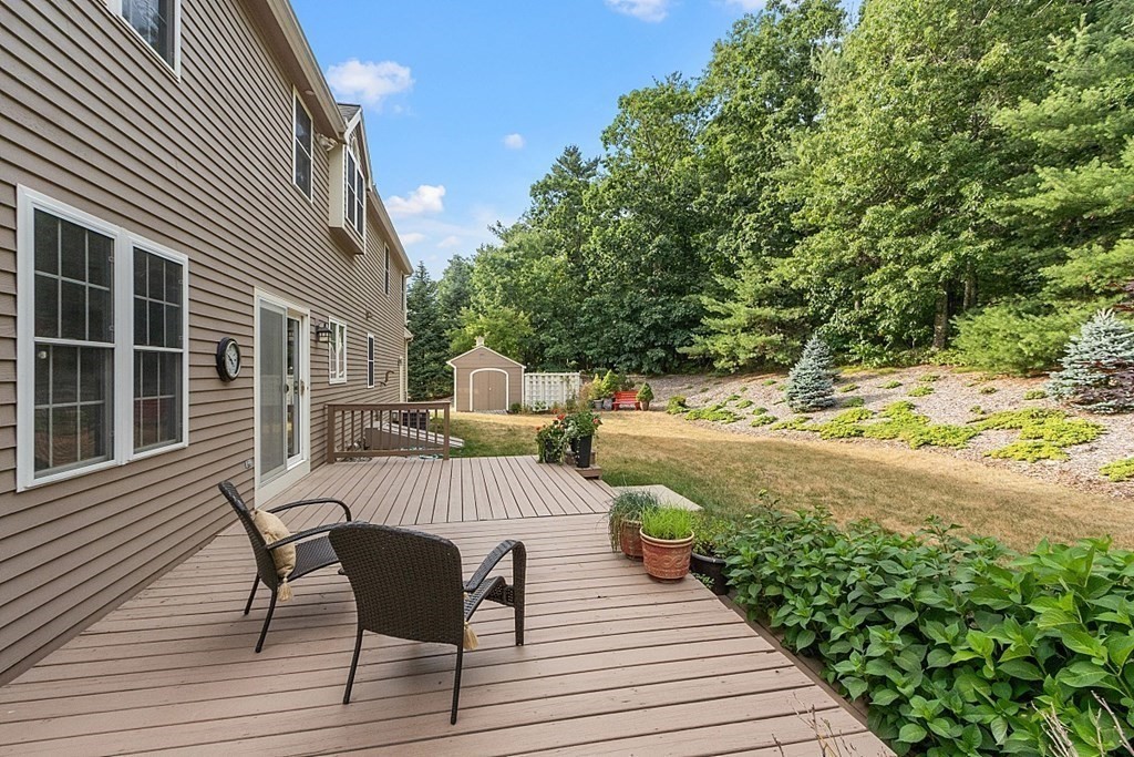 12 Whitetail Way Littleton, MA 01460 - Photo 37 of 39 a view of a chairs and table on the wooden deck