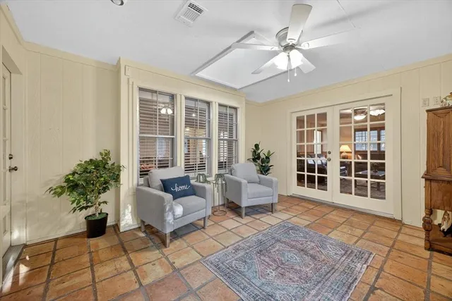 a living room with furniture and windows