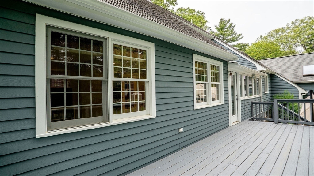 142 Baker Street Walpole, MA 02081 - Photo 27 of 42 a view of front deck with wooden floor and fence