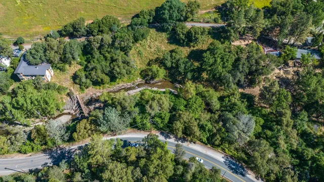 a view of a field with an ocean