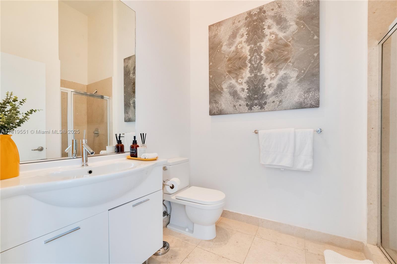 485 Brickell Avenue, Unit 4004 Miami, FL 33131 - Photo 18 of 22 a bathroom with a sink and a mirror