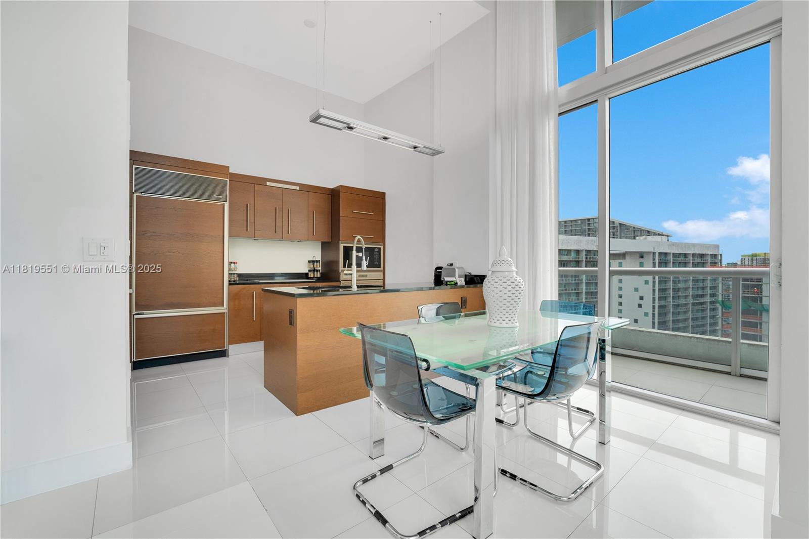 485 Brickell Avenue, Unit 4004 Miami, FL 33131 - Photo 10 of 22 a view of kitchen with furniture and refrigerator