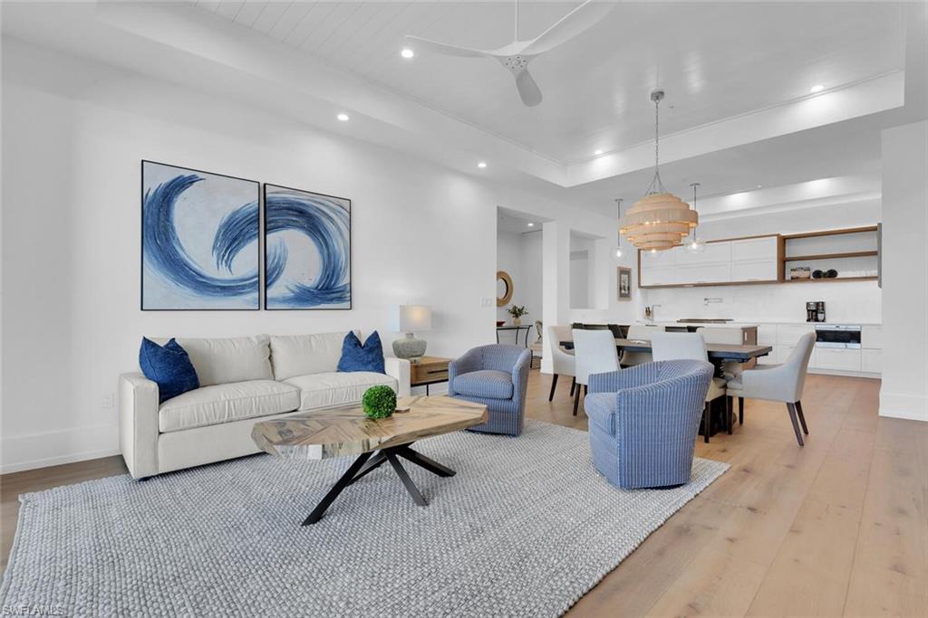 201 8th Street South, Unit 310 Naples, FL 34102 - Photo 12 of 39 a living room with furniture
