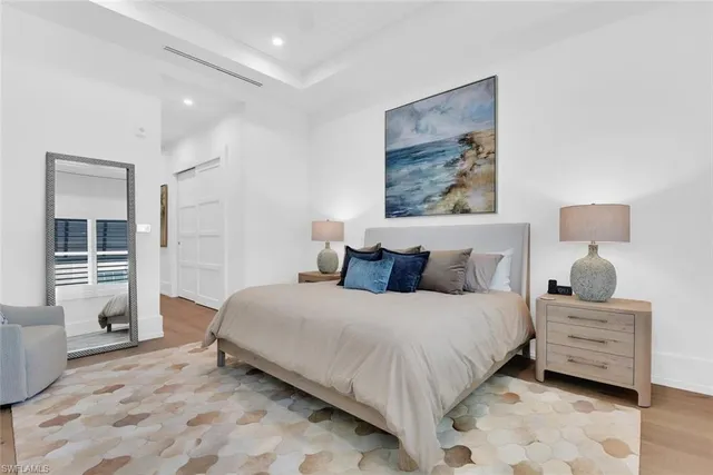 a bedroom with a large bed and a window