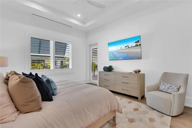 a bedroom with furniture and window