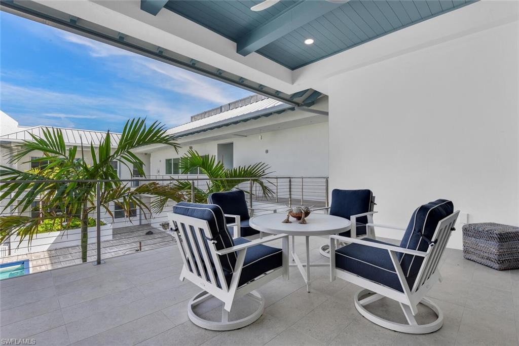 201 8th Street South, Unit 310 Naples, FL 34102 - Photo 24 of 39 a dining room with furniture