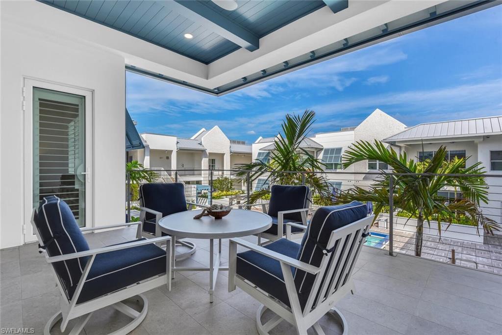 201 8th Street South, Unit 310 Naples, FL 34102 - Photo 25 of 39 a building outdoor space with patio furniture